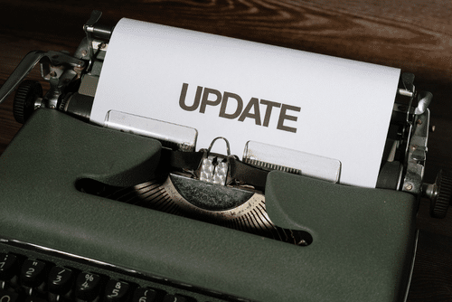 Vintage typewriter with the word Update typed on the paper