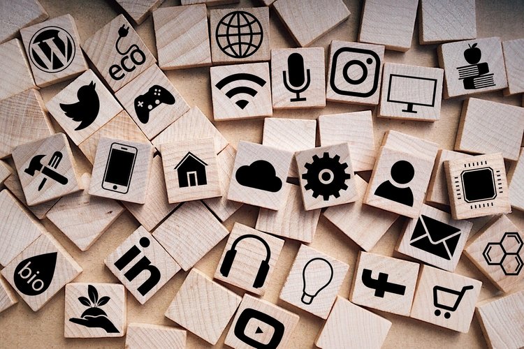 Scrabble tiles with app icons, showing the range of mobile apps available in places like the App Store