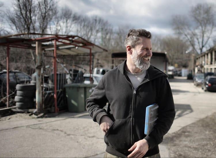 Businessman, foreman overseeing an on-site building project. Custom software helps cover all the gaps.