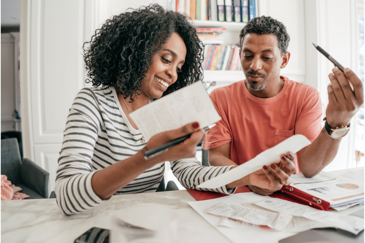 Man and woman reviewing documents and receipts