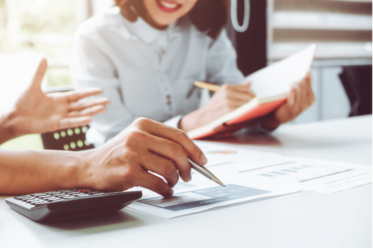 Man and woman reviewing documents and receipts