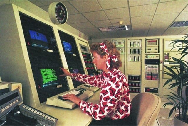 Woman at a fleet planning computer console in the 1990s