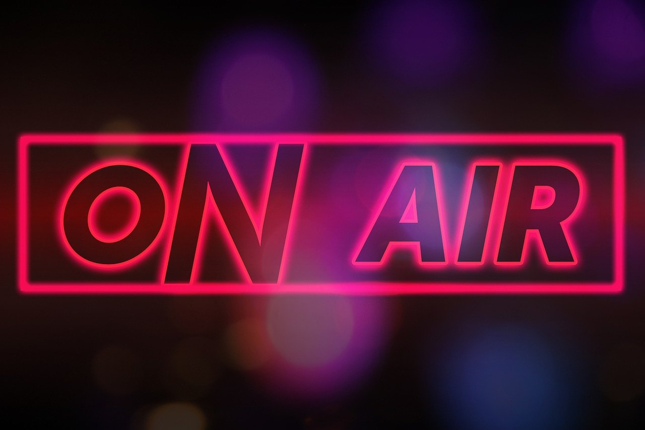 Neon graphic reading On Air