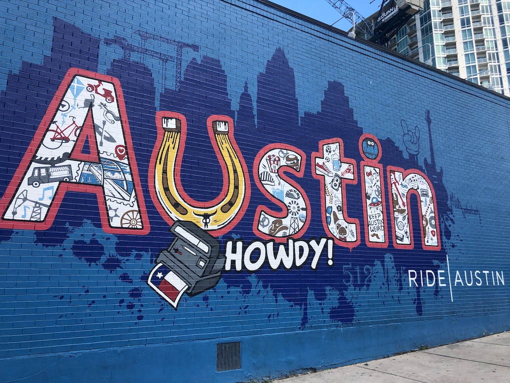 Mural on the side of a building in Austin, Texas, that says Austin Howdy!